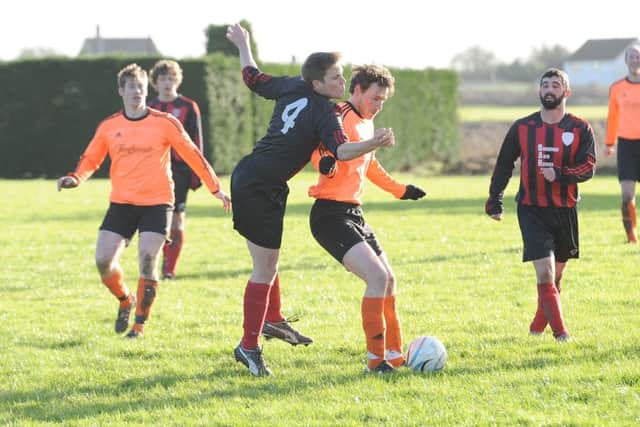 Fosdyke's Alex Barletta tangles with Spa's Tom Avison.