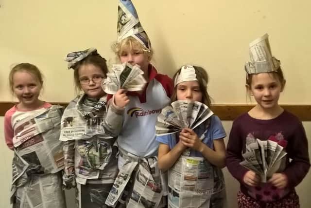 Brownies and Rainbow from 1st Wilsford group made these fun fashion outfits out of old copies of the Sleaford Standard.