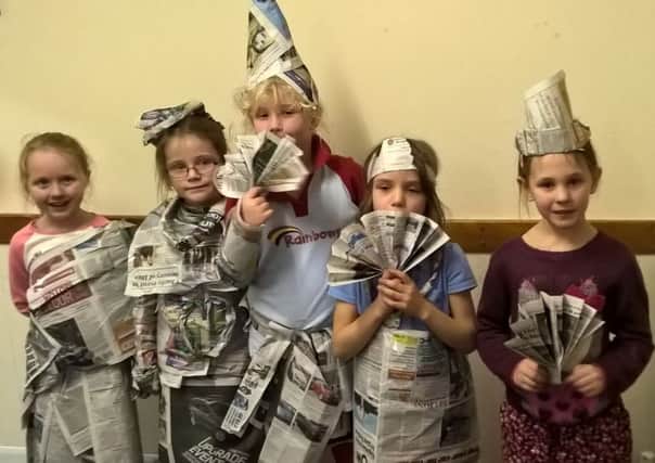 Brownies and Rainbow from 1st Wilsford group made these fun fashion outfits out of old copies of the Sleaford Standard.