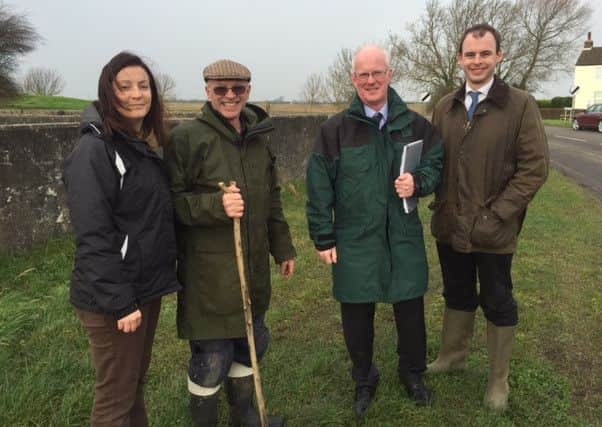 Pictured are (from left) Deborah Campbell, Environment Agency flood and coastal risk manager, Joe Taylor, chairman of Thorpe St Peter Parish Council, Phil Younge, Environment Agency area manager and MP Matt Warman. ANL-160502-125205001