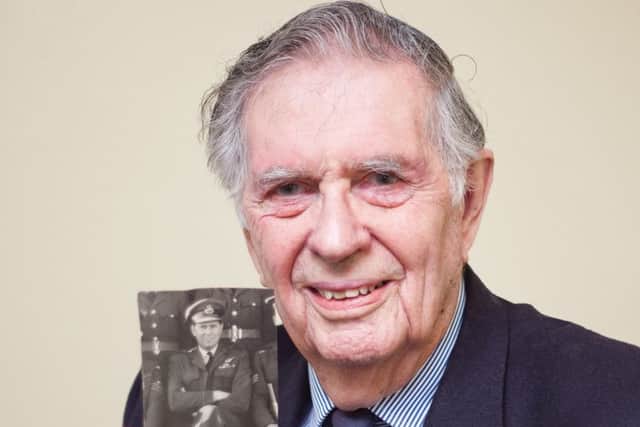 Coun Geoffrey Whittle with a picture of him with his 101 Squadron Bomber Command crew. EMN-160402-121900001