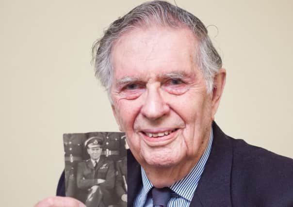 Coun Geoffrey Whittle with a picture of him with his 101 Squadron Bomber Command crew. EMN-160402-121900001