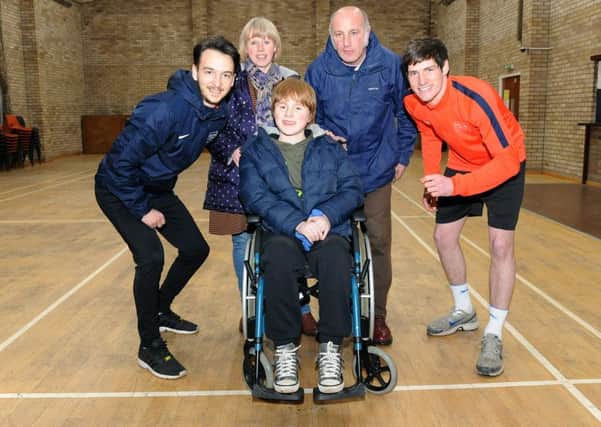 DAn Taylor and Marc Hitwell of Discovery Sports, are running Lincoln 10k to raise money for Joe Fulwood. L-R Dan Taylor - founder of Discovery Sports, Marlene Fulwood, Joe Fulwood 12, Joe Fulwood, Marc Hipwell - sports coach at Discovery Sports.