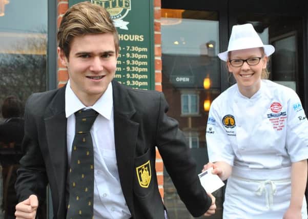 Track and swim star Declan Bennett, with The Elite Fish and Chip Company's Rachel Tweedale EMN-160902-121753001
