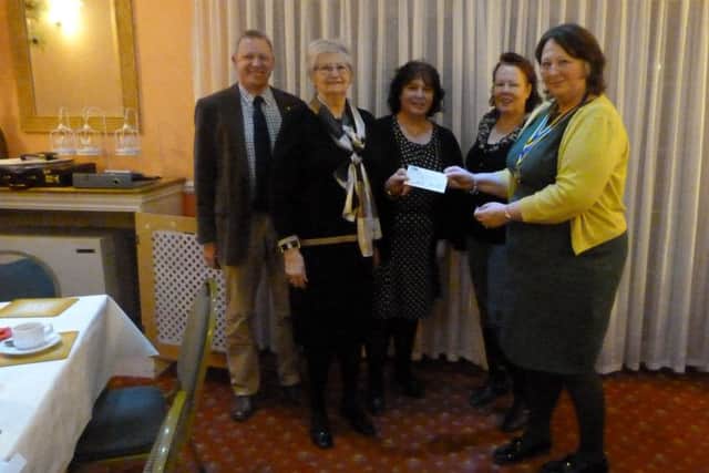 President of the Rotary Club of Louth, Dianna Broadmeadow, and Rotarian Paul Firth, the event organiser, presenting a cheque for £500 to Mrs.Gill Brooker, Jane Pegg and Sally Farrier of the Dementia Cafe at Louth Trinity Centre.