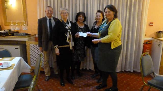 President of the Rotary Club of Louth, Dianna Broadmeadow,  and Rotarian Paul Firth, the event organiser, presenting a cheque for Â£500 to Mrs.Gill Brooker, Jane Pegg and Sally Farrier of the Dementia Cafe at Louth Trinity Centre.