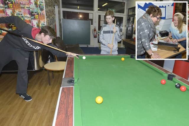 Teenagers enjoy a game of pool at the Louth Thirteen Plus Project. (Inset: Brenda Maltby and Chloe Jackson)