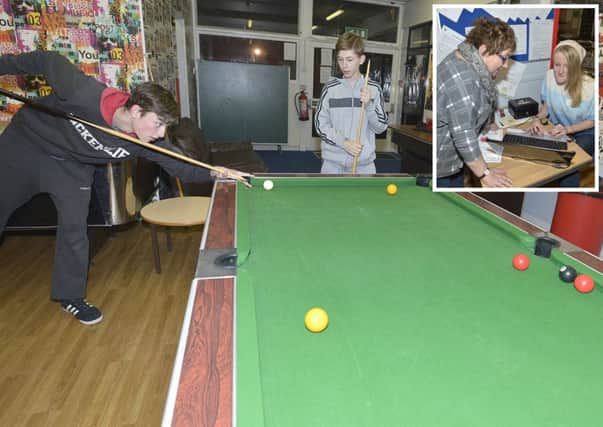 Teenagers enjoy a game of pool at the Louth Thirteen Plus Project. (Inset: Brenda Maltby and Chloe Jackson)