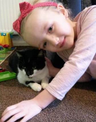 Francesca (5) is reunited with her beloved cat Molly.