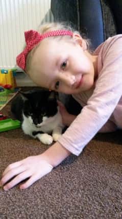 Francesca (5) is reunited with her beloved cat Molly.
