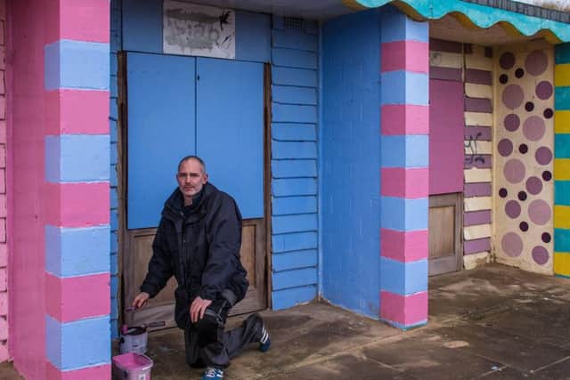 Bobby Baldwin has been busy repainting the beach chalets targeted with graffiti. Inset: Just one of the four chalets that were vandalised.