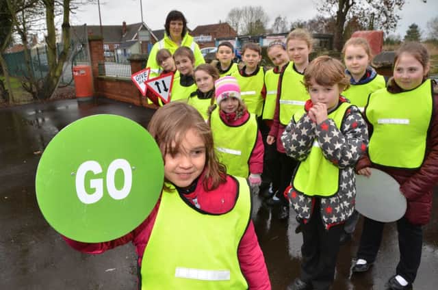 Children from Gosberton Academy with Kay Taman of Lincolnshire Road Safety Partnership during a two-day road safety event at the school.  Photo by Tim Wilson.