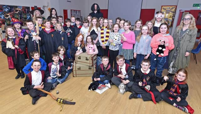 Pupils at Coningsby St Michael's all dressing up to play the part as their school hall was transformed into Hogwarts.