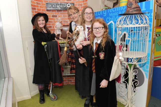 Harry Potter Day at Sleaford Library. From left - Ella Gibson, 10, Ann Davies - cultural service adviser, Jessica Savage, 10, and Gracie Greensmith, 8. EMN-160902-134331001