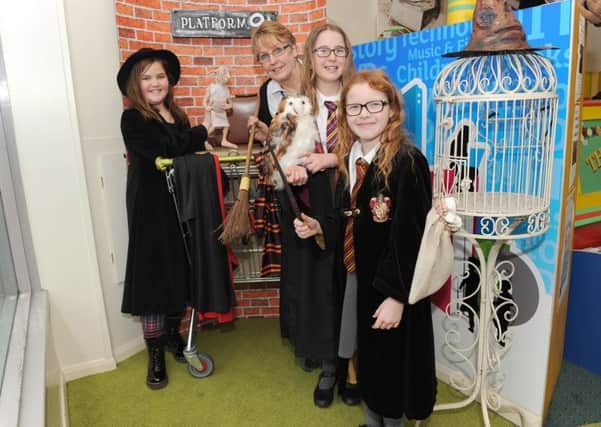 Harry Potter Day at Sleaford Library. From left - Ella Gibson, 10, Ann Davies - cultural service adviser, Jessica Savage, 10, and Gracie Greensmith, 8. EMN-160902-134331001