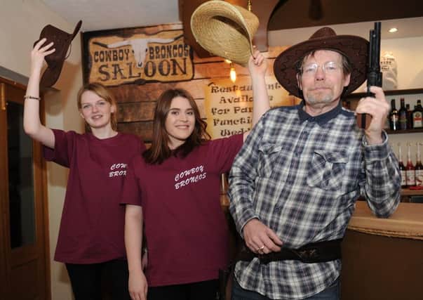 Opening night for new restaurant in Sleaford, Cowboy Broncos. L-R Paige Reed, Paige Hirst and owner Andrew Parks. EMN-160214-102655001
