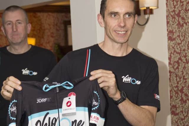 Adam Ellis receives his Velo One jersey at the launch night. Photo: Chris Galey.