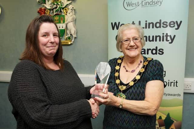 Samantha Coulam from Brookenby picks up her West Linidsey Citizen of the Year prize from Councillor Irmgard Parrott EMN-161102-152141001