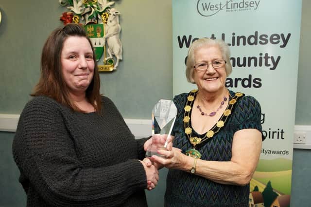 Samantha Coulam from Brookenby picks up her West Linidsey Citizen of the Year prize from Councillor Irmgard Parrott EMN-161102-152141001