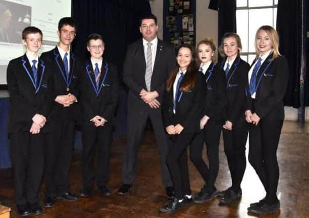 Brigg MP Andrew Percy with students at The Vale Academy where he went to talk politics. EMN-161002-163655001