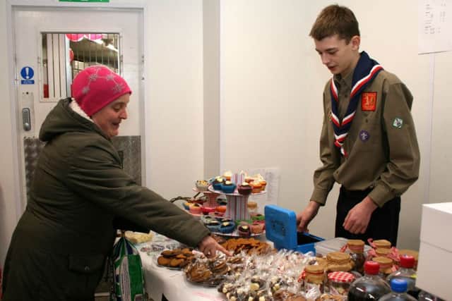 Scout Daniel Haynes, selling cakes for his Switzerland trip EMN-161002-125113001