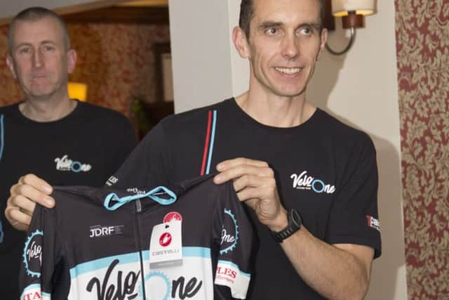 Adam Ellis receives his Velo One jersey at the launch night. Photo: Chris Galey.