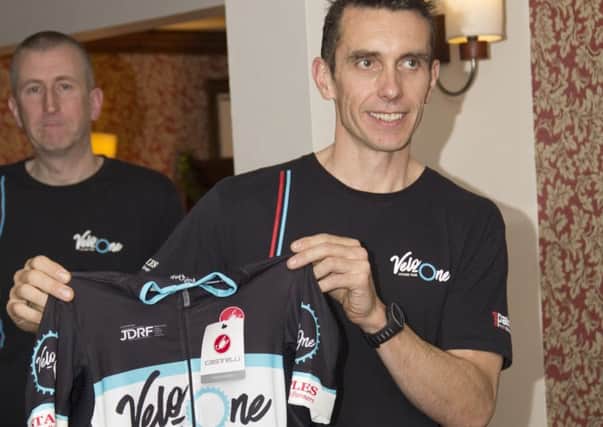 Adam Ellis receives his Velo One jersey at the launch night. Photo: Chris Galey.