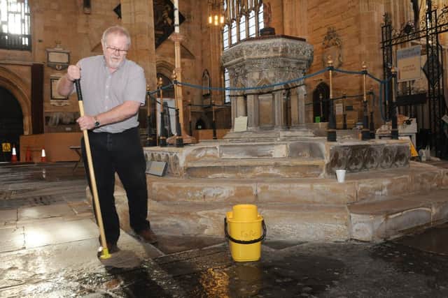 Boston Stump opens to the public for the first time since the floods, giving free pancakes to visitors. Bob Tamberlin - one of the volunteers cleaning the church ready for opening.