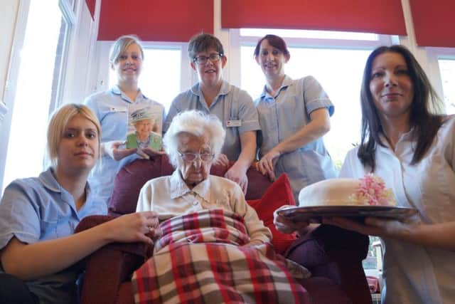 Mary Fisher celebrating her 105th birthday with staff at Waterloo House EMN-160223-103831001