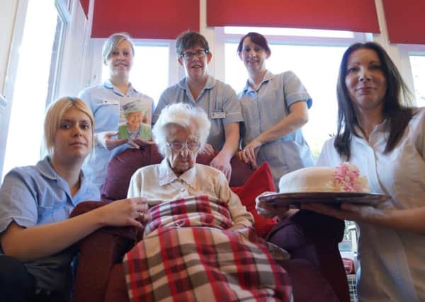 Mary Fisher celebrating her 105th birthday with staff at Waterloo House EMN-160223-103831001