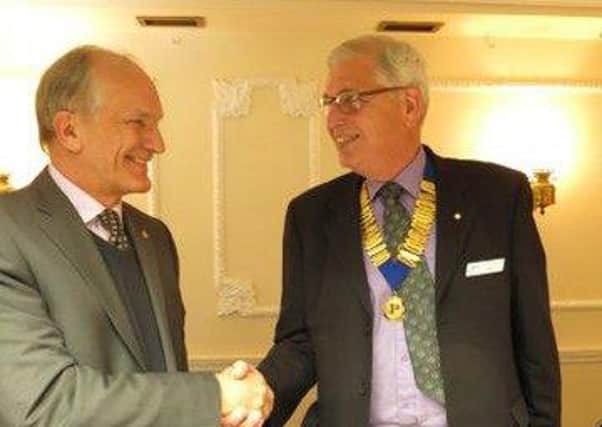 Immediate Past Chairman Neil Carter (left) congratulating the incoming Chairman Bob Aspinall of the Men's Probus in Horncastle EMN-161202-174305001