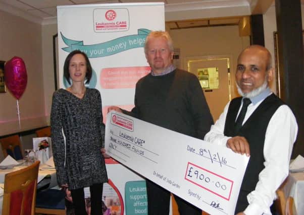 Presenting the cheque from proceeds of the India Garden charity night. From left - Marie Cahn, Kevin Hately - fundraising manager for Leukaemia CARE and Nadim Aziz of teh India Garden. EMN-160902-114956001