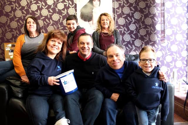 Marathon man Richard Bannister (centre) is running the London Marathon this year for Little People UK, a charity founded by Samantha and Warwick Davis. Pictured with their son Harrison (right) and top, Richards wife Lisa, their son Joseph and Sams sister Susanne.