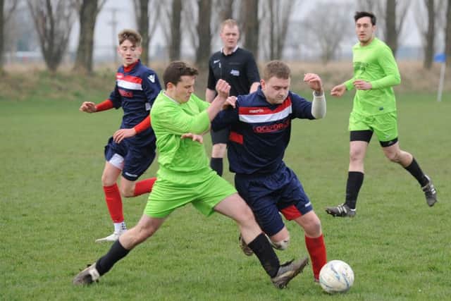 Shane Perkins and Reece Snade battle as Boston Titans faced FC Hammers.