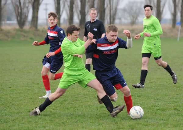 Shane Perkins and Reece Snade battle as Boston Titans faced FC Hammers.