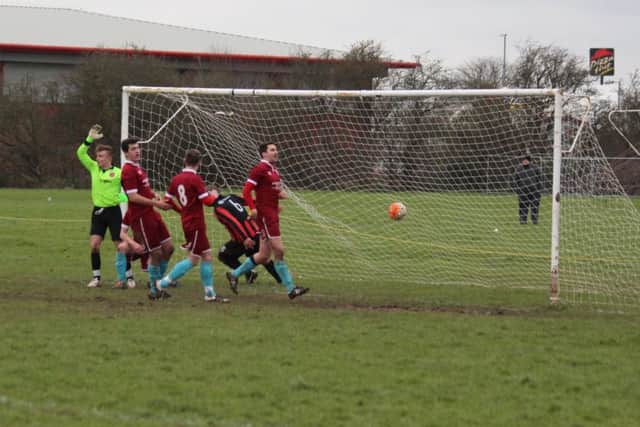 Michael Howard scores for United. Photo: Stephen Willmer.
