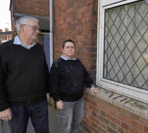 Roger and Jackie Featherstone outside their home. Mr Allman was too unwell to take part in the photograph.