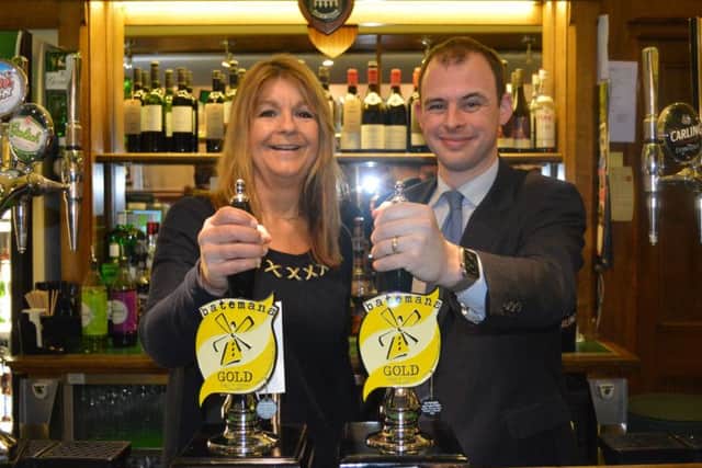 Matt Warman MP with Jaclyn Bateman, marketing director of Batemans Brewery in Parliament's Stranger's Bar ANL-160216-142304001