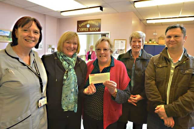 Pictured is Christine Raithby, who played Prince Charming, in the pantomime, Julia Gracie (pantomime director), Barbara Boobyer (chairman of Louth League of Friends), Liz Herdy (committee member) and Johnathon Hinkins (played ugly sister Beyonce in the panto).