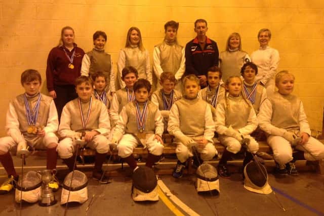 Louth Fencing Club. From left, back - Abbie Johnson, Kate Harris, Emily Goolden, Connor Webster, Jim Harris, Paula Webster, Kim DeLarge; middle - Joe Blair, Alex Judge, Sam Blair, William Lonsdale, Archie Broughton; front  Wilf Broughton, Henry Unsworth, Nick Freitas, Aaron Stacey, Catelin Hall, Ben Crick. EMN-160218-164933002