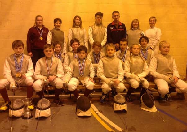 Louth Fencing Club. From left, back - Abbie Johnson, Kate Harris, Emily Goolden, Connor Webster, Jim Harris, Paula Webster, Kim DeLarge; middle - Joe Blair, Alex Judge, Sam Blair, William Lonsdale, Archie Broughton; front  Wilf Broughton, Henry Unsworth, Nick Freitas, Aaron Stacey, Catelin Hall, Ben Crick. EMN-160218-164933002