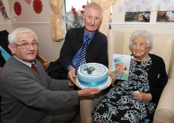 Ex-Wrangle resident, Phyllis Bradshaw celebrating her 100th birthday at Wainfleet Care Home. Pictured with her son Bernard Bradshaw (left) and brother Raymond Skinner (right).