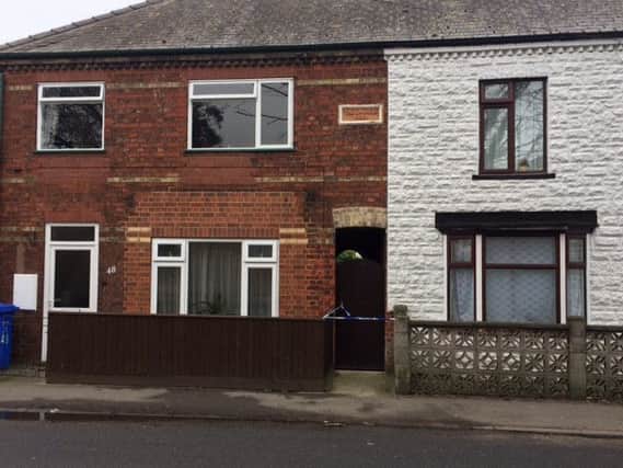 Police tape outside the house in Fishtoft Road,  Boston, where police were investigating the death of a 23-year-old man. ANL-160220-102115001