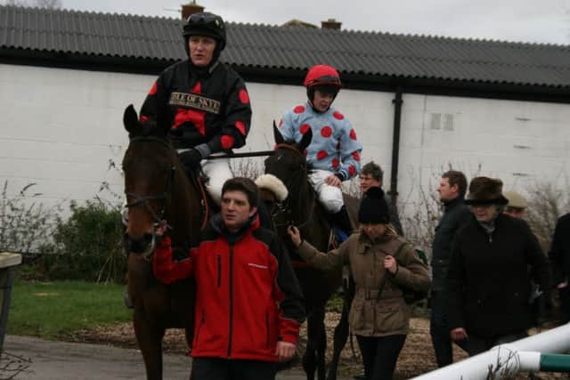 Card Game returns to the winner's enclosure with Jamie Hamilton aboard after winning the second Race. EMN-160222-132146002