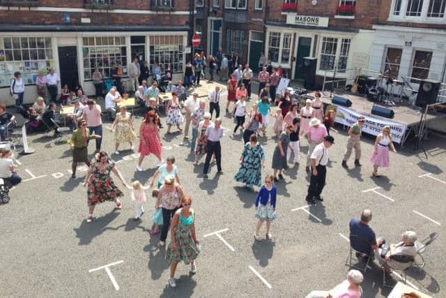 52nd Street Jump teach Lindy Hop in Louth's Cornmarket at a previous Zero Degrees Festival in 2014.