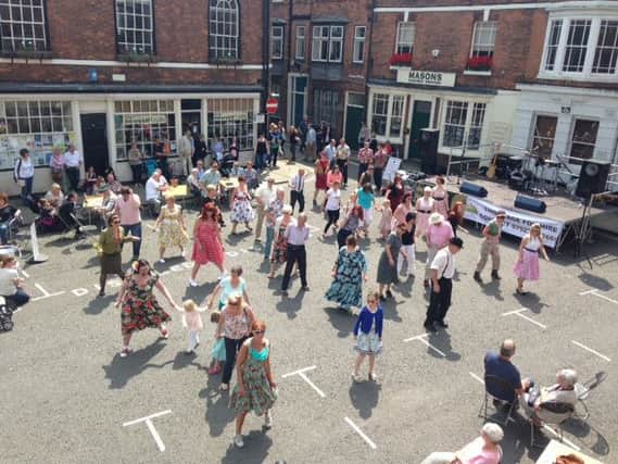 52nd Street Jump teach Lindy Hop in Louth's Cornmarket at a previous Zero Degrees Festival in 2014.