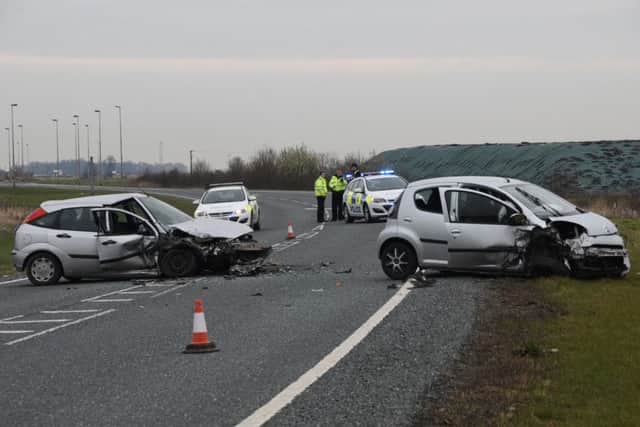 Police at the scene where a Ford Focus and Citreon were in collision on the A16 in Crowland. Photo by David Lowndes.