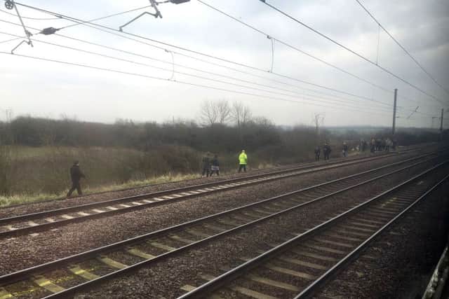 Steam enthusiasts who disrupted the inaugural run of the Flying Scotsman after its decade-long, £4.2 million refit by standing on the track to take photographs.
Photo credit should read: Network Rail/PA Wire RAIL_Scotsman_093414.JPG