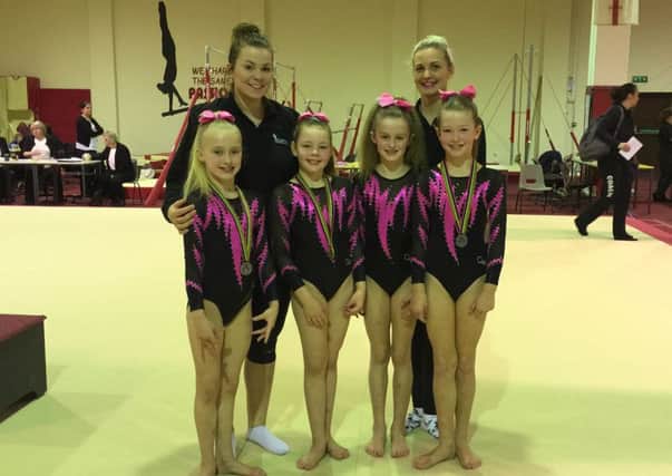 Pictured are Amelia, Tallulah, Eden and Lyle (front left to right) and their coaches Kim Glasel and Kim Hughes.