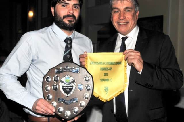 Oliver Burford (left) receives the Lincolnshire ECB runners-up shield and pennant from sports broadcaster John Inverdale. Photo: Nigel West